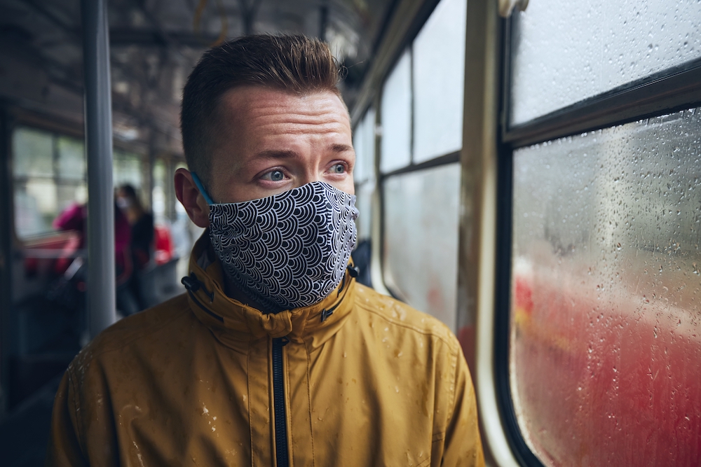 Man wearing face mask in public transportation
