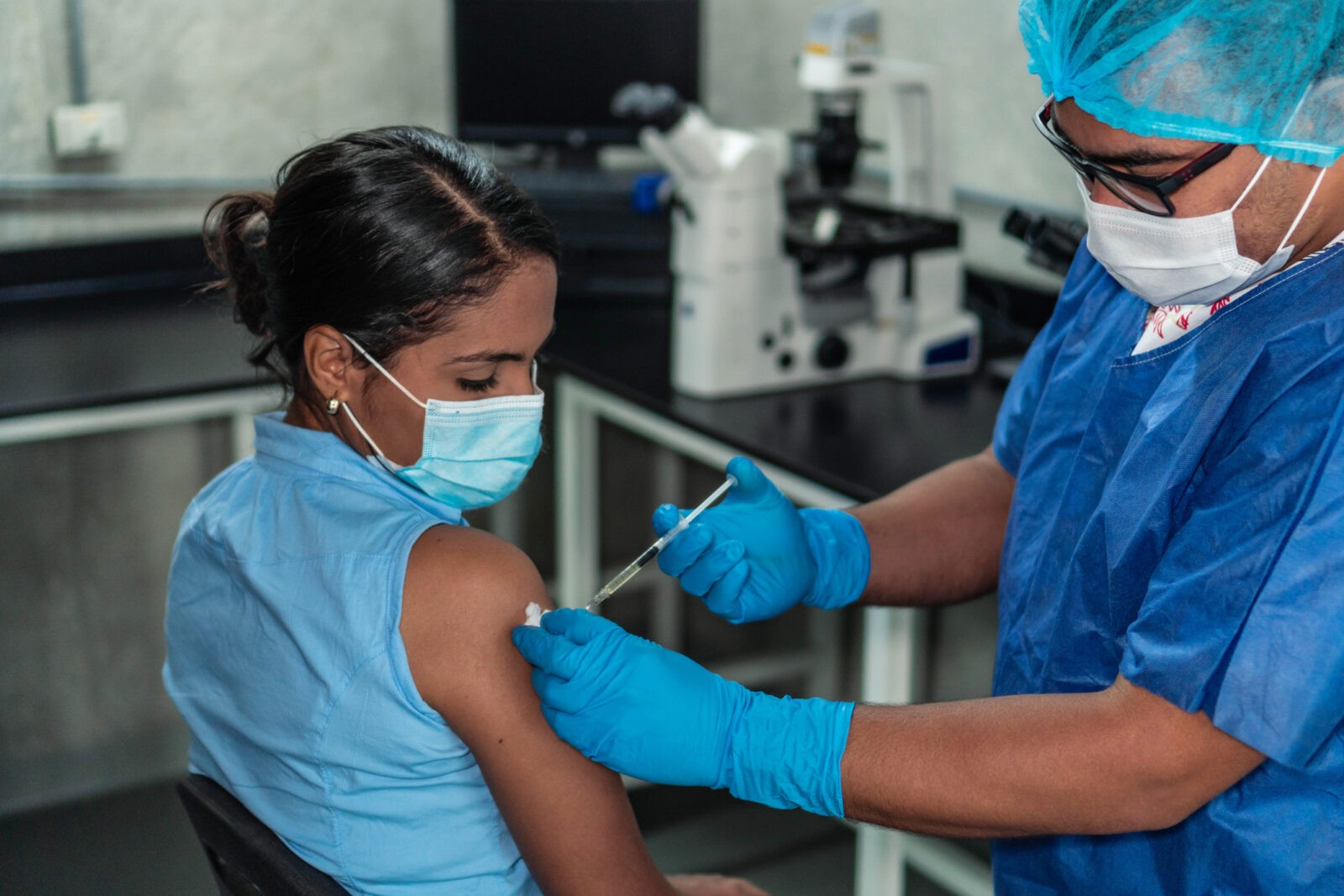 Young woman receiving coronavirus vaccine