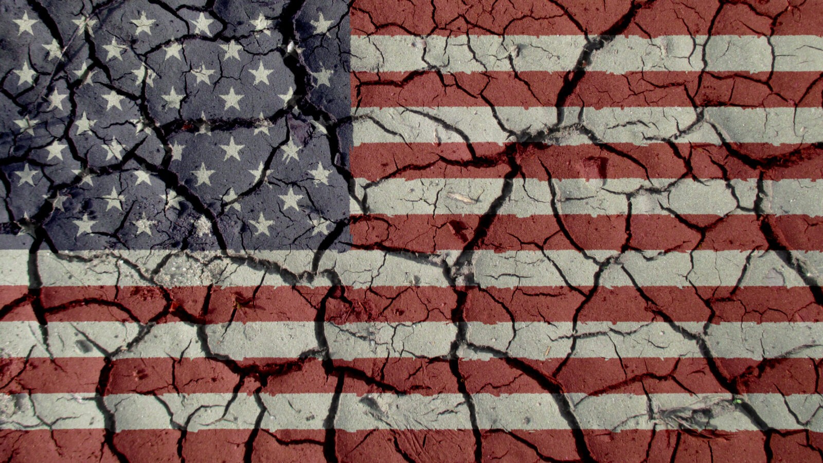 Political Crisis Concept: Mud Cracks With US Flag