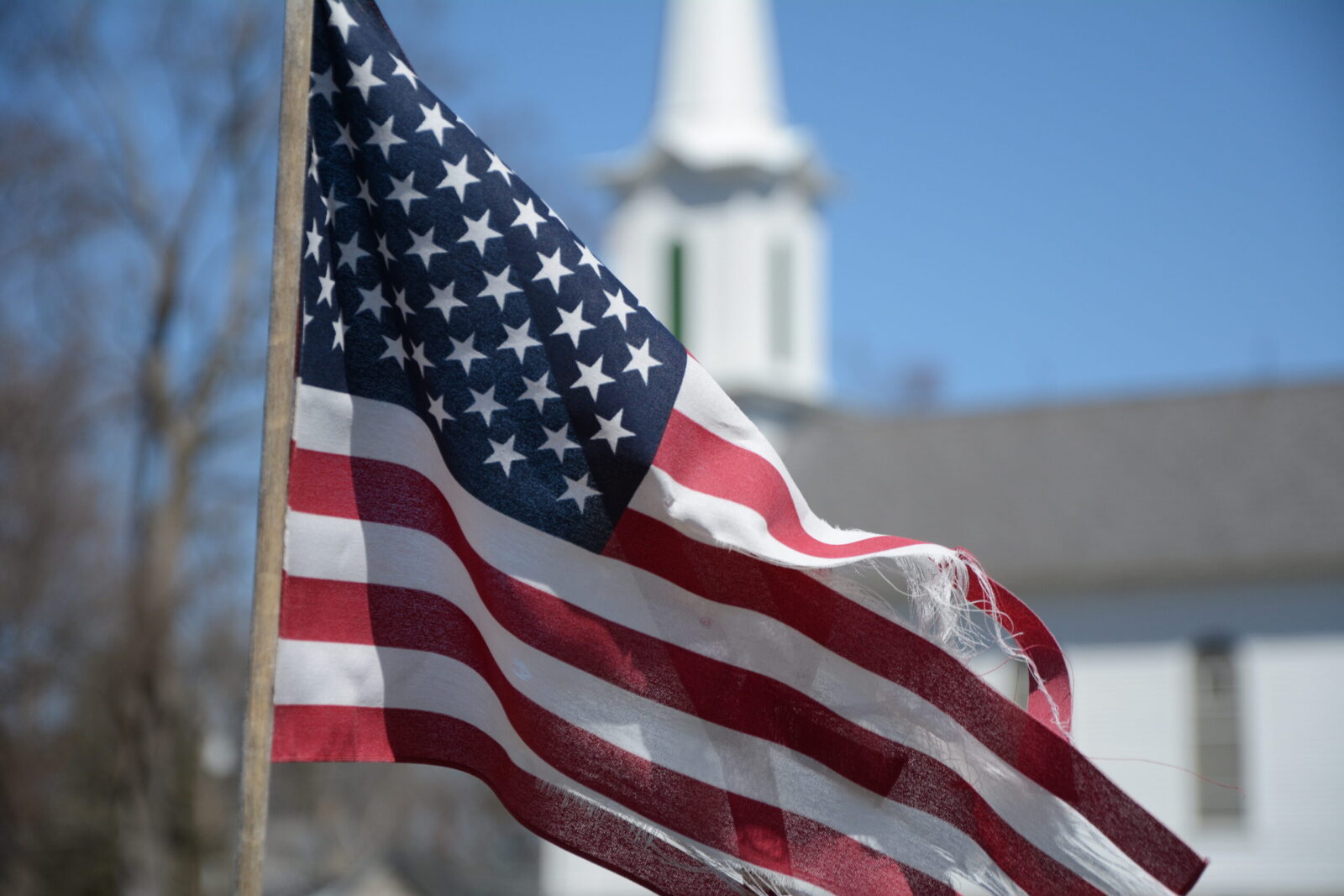 Americas Flag, Old Glory Flies Freely In A Country Churchyard in Hope New Jersey