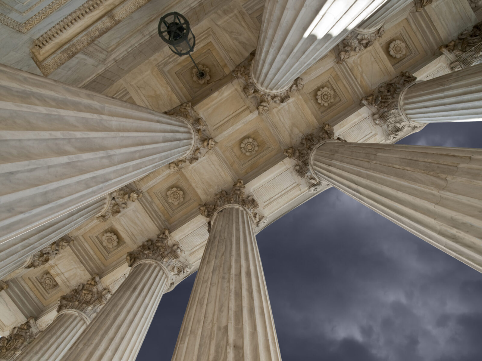 US Supreme Court building with storm sky in Washington DC.