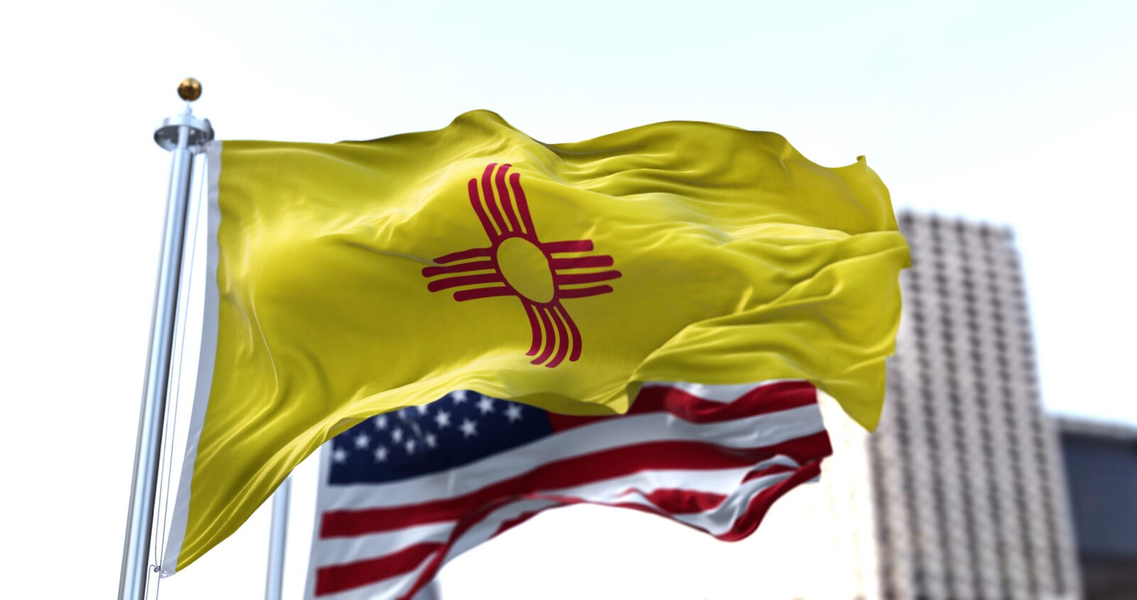 the flag of the US state of New Mexico waving in the wind