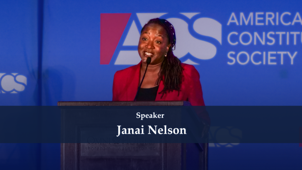 Janai Nelson speaking at a podium at an American Constitution Society event.